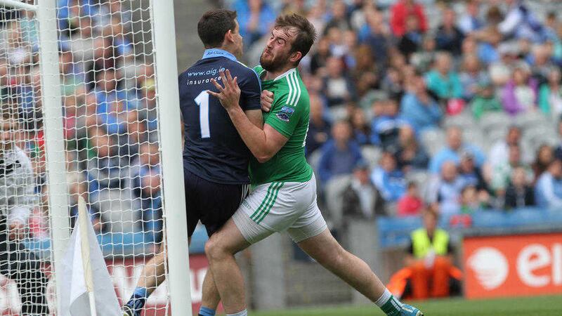 Dublin's Stephen Cluxton is pushed over the line by Se&aacute;n Quigley for Fermanagh's first goal in their All-Ireland quarter-final meeting