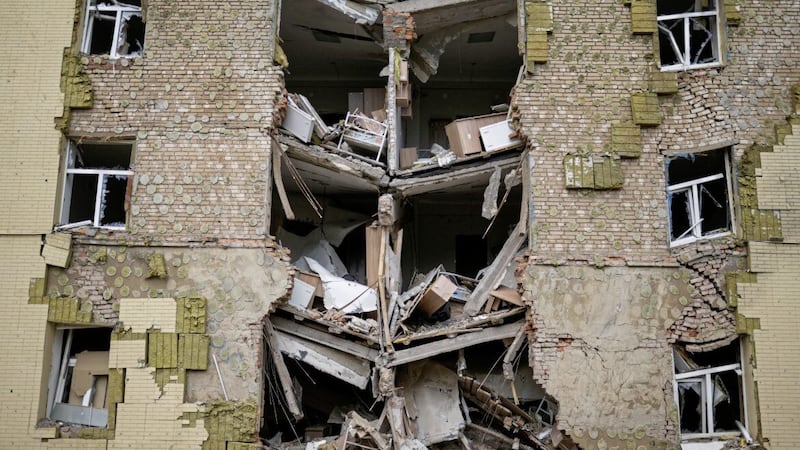 Debris hangs from a residential building heavily damaged in a Russian bombing in Bakhmut, eastern Ukraine, in May last year 