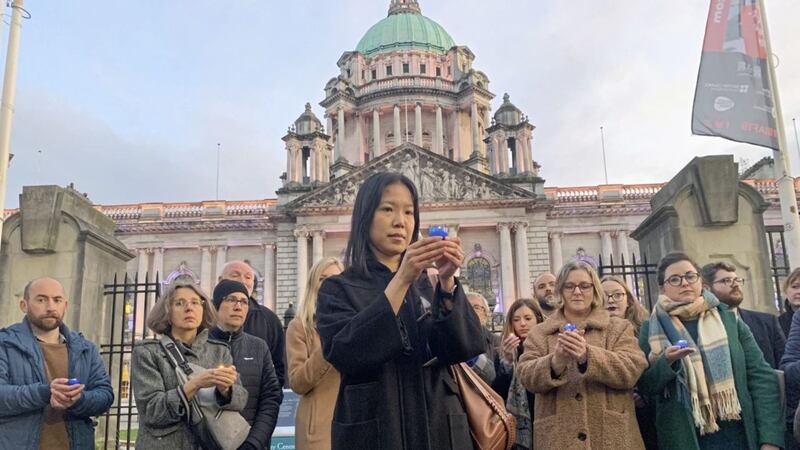 Rebecca Ng from the Chinese Welfare Association last night at Belfast City Hall for a candlelight vigil for the 39 Chinese nationals found dead in a lorry container. Picture by Hugh Russell 