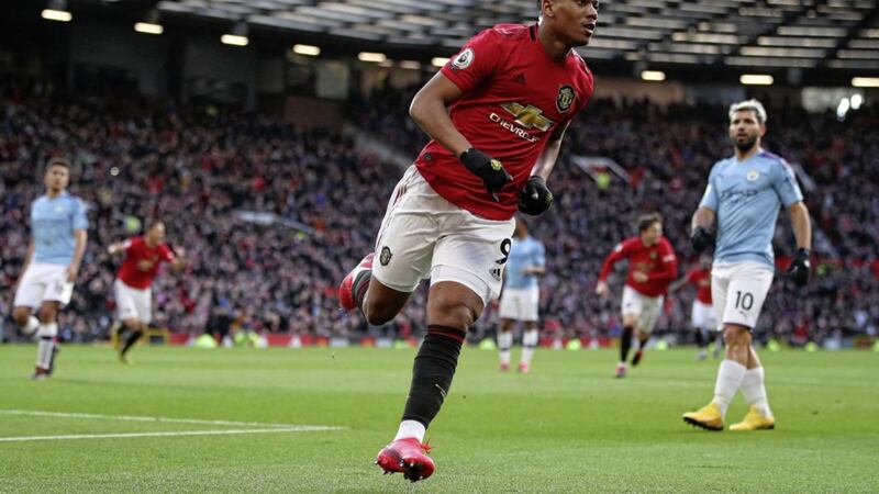 Manchester United&#39;s Anthony Martial celebrates scoring his side&#39;s first goal of the game during the Premier League match at Old Trafford 