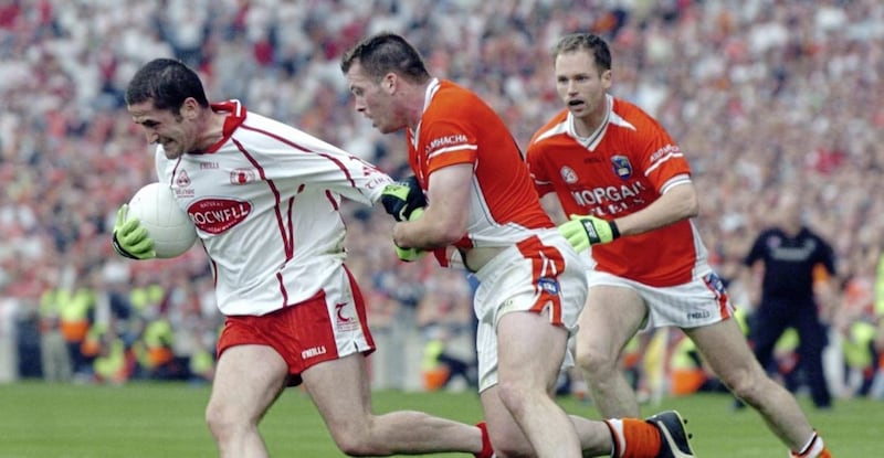 Ciaran McKeever tries to get to grips with Tyrone&#39;s Stephen O&#39;Neill during the 2005 All-Ireland semi-final 