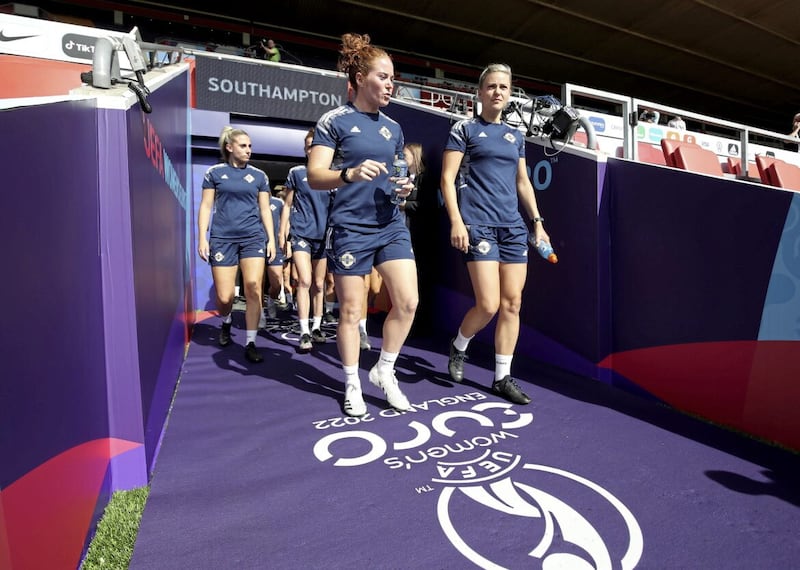 Northern Ireland's Marissa Callaghan and Nadene Caldwell head onto the St Mary's Stadium pitch in Southampton for a training session ahead of the Euros match against Norway.