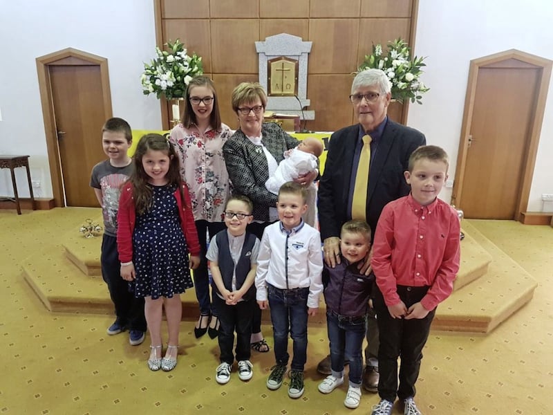 Patsy and Veronica Gildernew with their eight grandchildren 