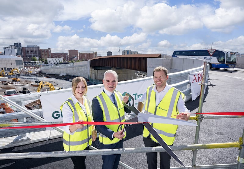 L-R: Laura Brady, project manager, Arup; Chris Conway, group chief executive, Translink; and Andrew Henry, contracts director, Graham, opening the new busway bridge.