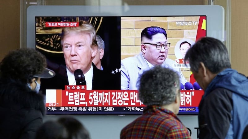 A TV screen showing North Korean leader Kim Jong Un and US president Donald Trump, left, at the Seoul Railway Station in Seoul, South Korea Picture by Ahn Young-joon/PA 