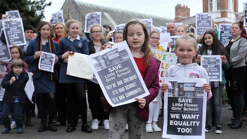 Concerned parents and pupils gather outside Little Flower. Picture by Philip Walsh 