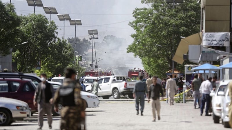 Security forces inspect near the site of a suicide attack in Kabul during the first week of Ramadan, Afghanistan, on Wednesday. Picture by Massoud Hossaini, Associated Press 