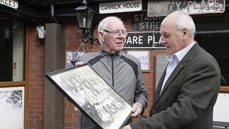 Frank Dempsey, left, and Dr Sean Brennan whose grandfather played for Alton United look at a picture of the historic club. Picture by Hugh Russell. 