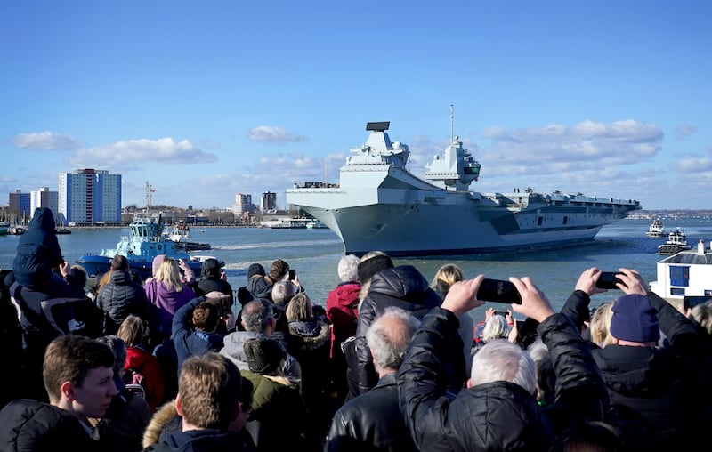 Crowds watch as the Royal Navy aircraft carrier HMS Prince of Wales sets sail from Portsmouth Harbour on Monday