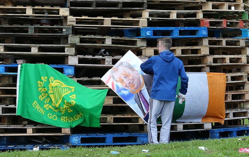 An election poster is placed at the New Lodge bonfire in north Belfast&nbsp;