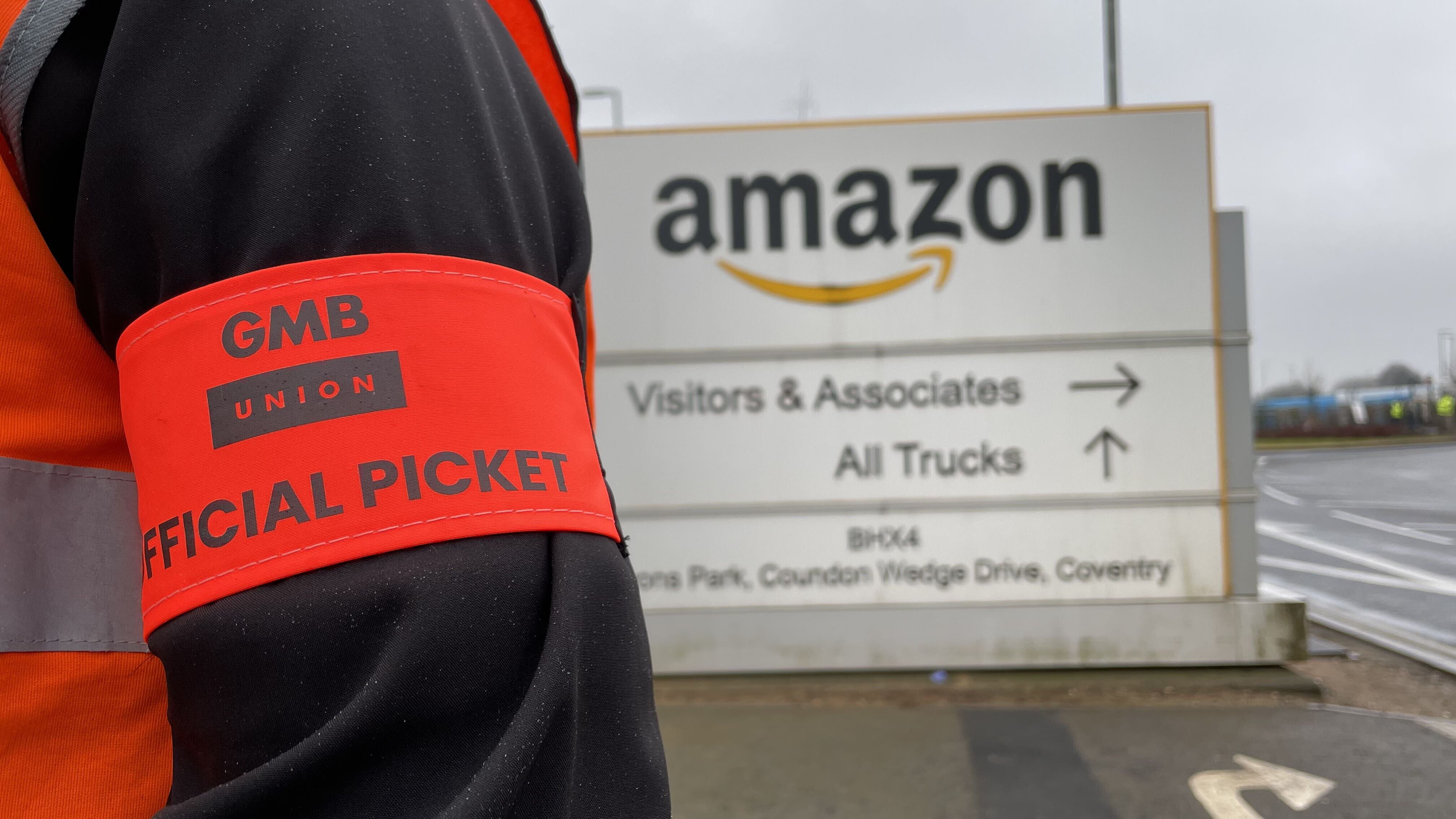 Members of the GMB union on the picket line outside the Amazon fulfilment centre in Coventry earlier in the year (Phil Barnett/PA)