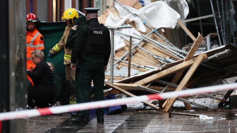 Emergency Services at the scene at Castle Lane in Belfast on Sunday after scaffolding became unsafe. A member of the public has been struck by falling debris and is being treated at the scene by emergency services in attendance. 
PICTURE COLM LENAGHAN