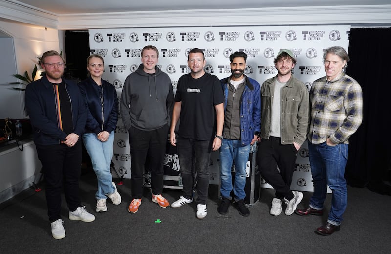 (Left to right) Rob Beckett, Joanne McNally, Joe Lycett, Kevin Bridges, Paul Chowdhry, Seann Walsh, and John Bishop backstage during A Night of Comedy for the Teenage Cancer Trust show