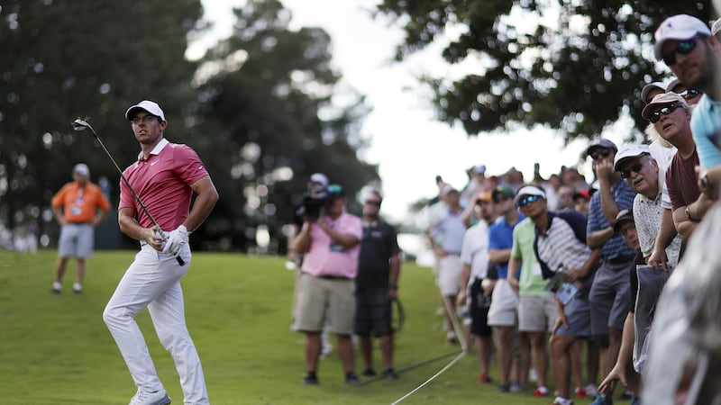 &nbsp;<span style="font-family: Arial, Verdana, sans-serif; ">McIlroy hits on the fairway at the 18th hole of the first round of the Tour Championship at Atlanta. Picture: AP Photo/ David Goldman</span>