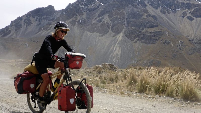 Kate Rawles riding through the Cordillera Blanca mountains in Peru during The Life Cycle bamboo bike tour 