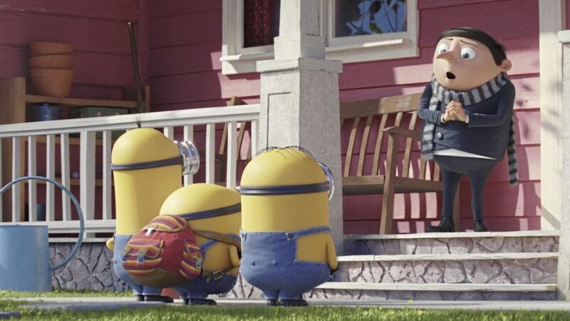 (Far left) Kevin (voiced by Pierre Coffin) and Gru (voiced by Steve Carell) in Minions: The Rise of Gru. 