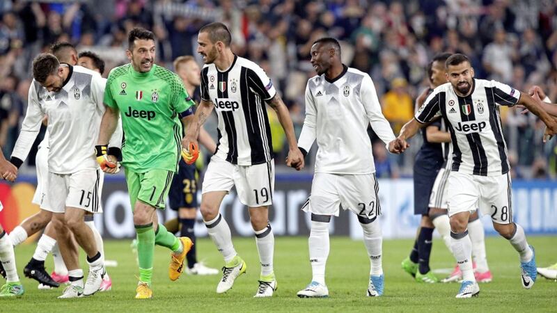 Juventus goalkeeper Gianluigi Buffon, 2nd left, and his team-mates celebrate after securing their progress to the Champions League final 