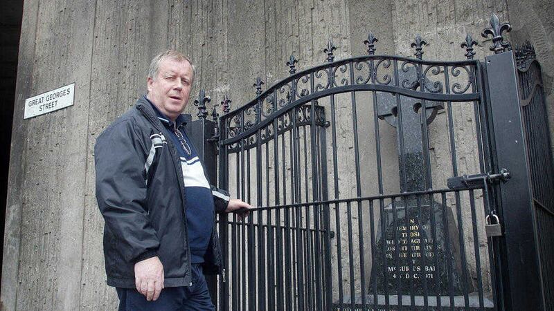 Robert McClenaghan looks at the memorial to the 15 people killed in the McGurk&#39;s Bar atrocity, which included his uncle Philip Garry. Picture by Hugh Russell 