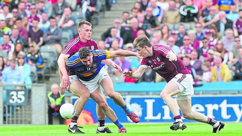 Galway's David Wynne and Liam Silke try to close down Tipperary's Philip Austin during last Sunday's All-Ireland Senior Football Championship quarter-final at Croke Park<br />Picture by Colm O'Reilly