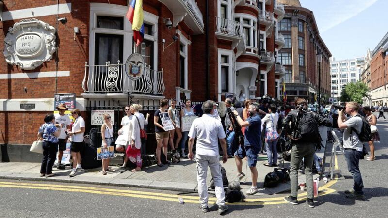 Supporters of Julian Assange and media outside the Ecuadorian embassy in London, after a planned announcement by the WikiLeaks founder from the balcony of the embassy has been deferred on the advice of his legal counsel, following the agreement of an &quot;imminent meeting&quot; with British authorities Picture: Jonathan Brady/PA 