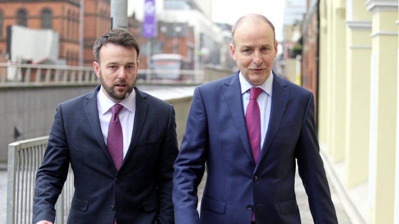 Colm Eastwood and Miche&aacute;l Martin arrive to announce a new partnership between the SDLP and Fianna F&aacute;il. Picture by Mal McCann 