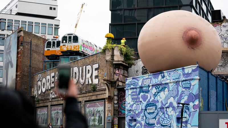 Video: Giant inflatable boobs appear all over London to support  breastfeeding in public – The Irish News