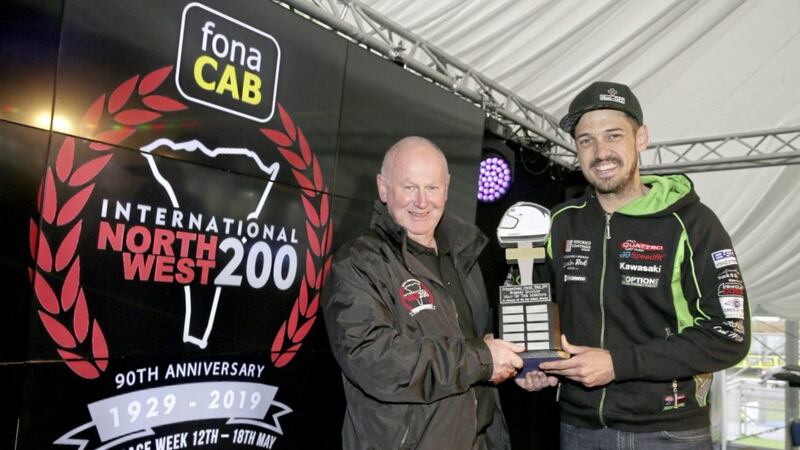 James Hillier (Quattro Plant Kawasaki) receives the Robert Dunlop Man of the Meeting award from fonaCAB International North West 200 in association with Nicholl Oils Event Director, Mervyn Whyte, after his 1st, 2nd and 3rd place finishes at this year&#39;s 90th anniversary races. Picture by Stephen Davison/Pacemaker Press 