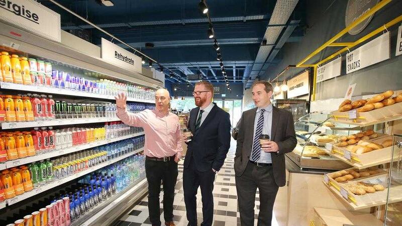 Pictured in the new Centra Cathedral Quarter are owner Donagh McGoveran (left) and Musgrave NI managing director Michael McCormack with Economy Minister Simon Hamilton. Photo: Kelvin Boyes/Press Eye 