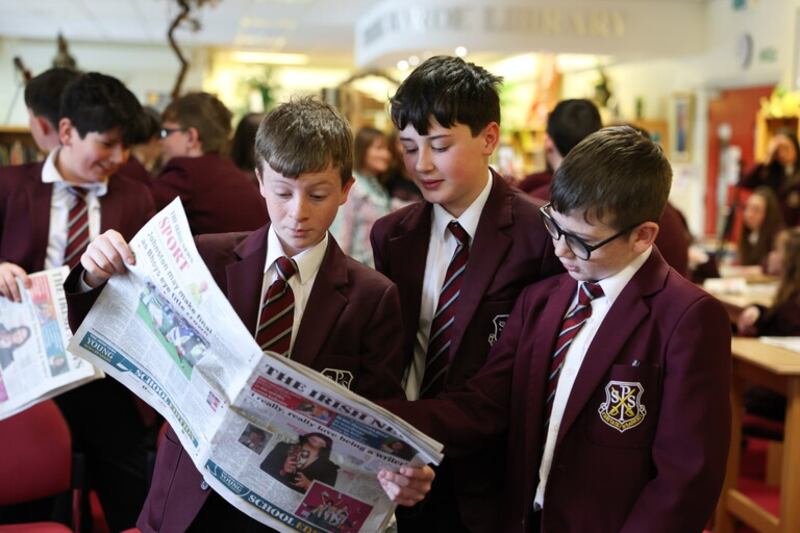 Pupils from St. Pauls High School Bessbrook reading The Irish News Young News Readers School Edition.