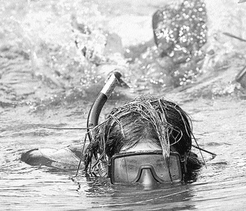 TURF WAR... Don&rsquo;t panic, it&rsquo;s only a bog snorkeller.. Julia Galvin from County Kerry competes in the World Bog Snorkelling Championship in Wales on August 30 1999 