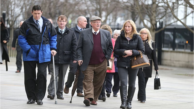 Relatives of some of the men killed at Kingsmill leaving court today. Picture by Hugh Russell