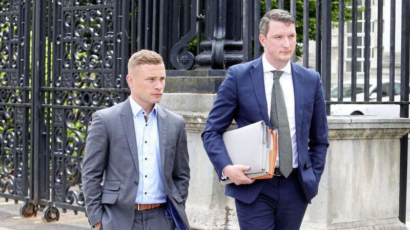 .Belfast Boxer Carl Frampton attends Belfast High Court with his solicitor John Finucane Picture Mal McCann. 