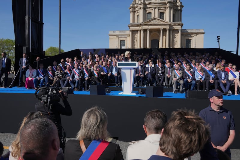 Marine Le Pen delivers her speech during the rally near the parliament in Paris (Michel Euler/AP)