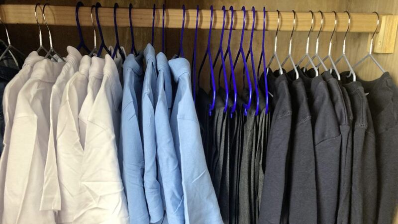 School uniform hanging in wardrobe. 