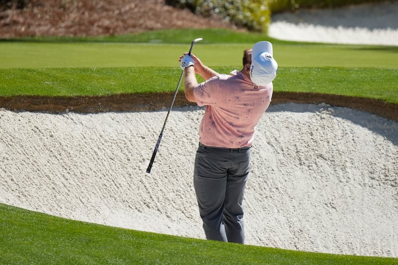 Tyrrell Hatton reacts to his bunker shot on the 12th hole during round three of the 88th Masters (Matt Slocum/AP)