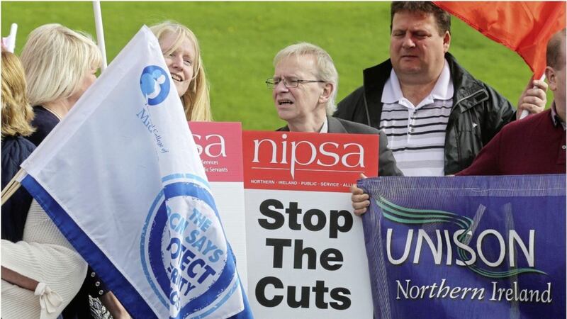 Union members marched through the grounds of Stormont to deliver a letter of protest about health cuts to permanent secretary Richard Pengelly at the Department of Health in Castle Buildings. Picture by Hugh Russell 