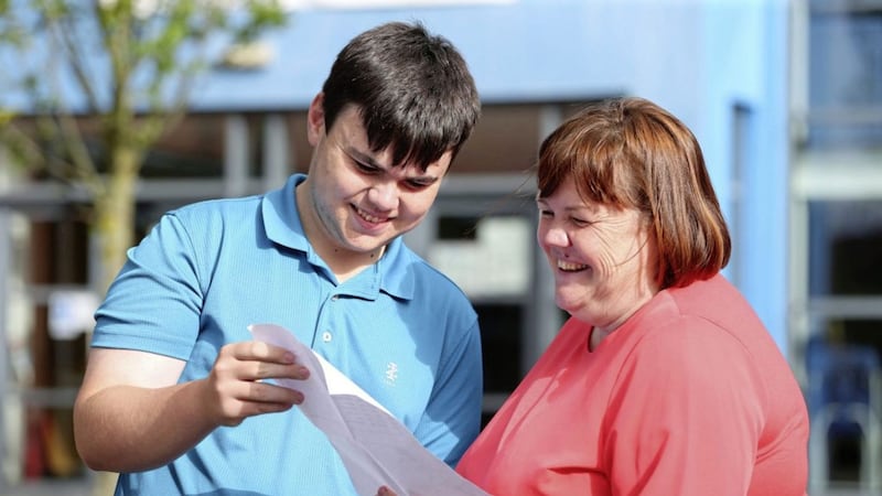 La Salle student John Stuart and his mother Frances look over his GCSE results. Picture by Mal McCann 