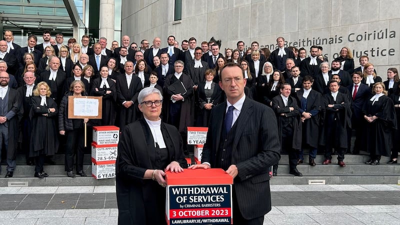 Sara Phelan SC, chair of the Council of The Bar of Ireland and Sean Guerin SC, chair of the Criminal State Bar Committee with criminal law barristers as they withdraw services over pay restoration at Criminal Courts of Justice (Cillian Sherlock/PA)