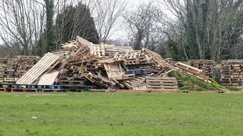 Wood pallets on open ground near houses at Greenpark Drive in Antrim