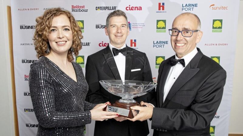 Danske Bank chief executive Kevin Kingston (right) receives the Responsible Company of the Year trophy from Lisa McIlvenna (Business in the Community deputy managing director) and Noel Mullan, commercial director at sponsors Heron Bros. Photo: Paul Faith 