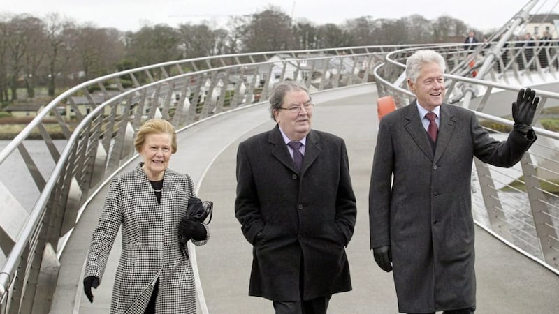 Former United States President Bill Clinton on the Derry Peace Bridge with John and Pat Hume, during a visit to Derry in 2014. Picture Margaret McLaughlin 