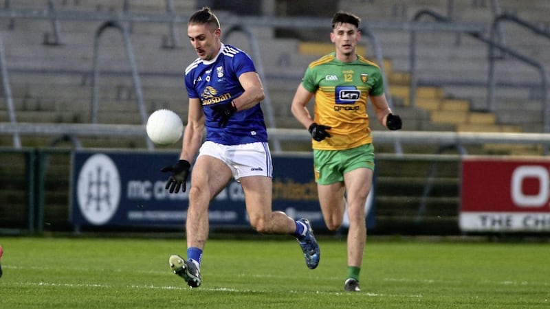 Cavan's    Killian  Clarke strides away fin action with   Donegals   Michael  Langan   in the Ulster Senior Football Championshp final  at the Athletic Grounds, Armagh.&nbsp; &nbsp;Picture by Seamus Loughran.