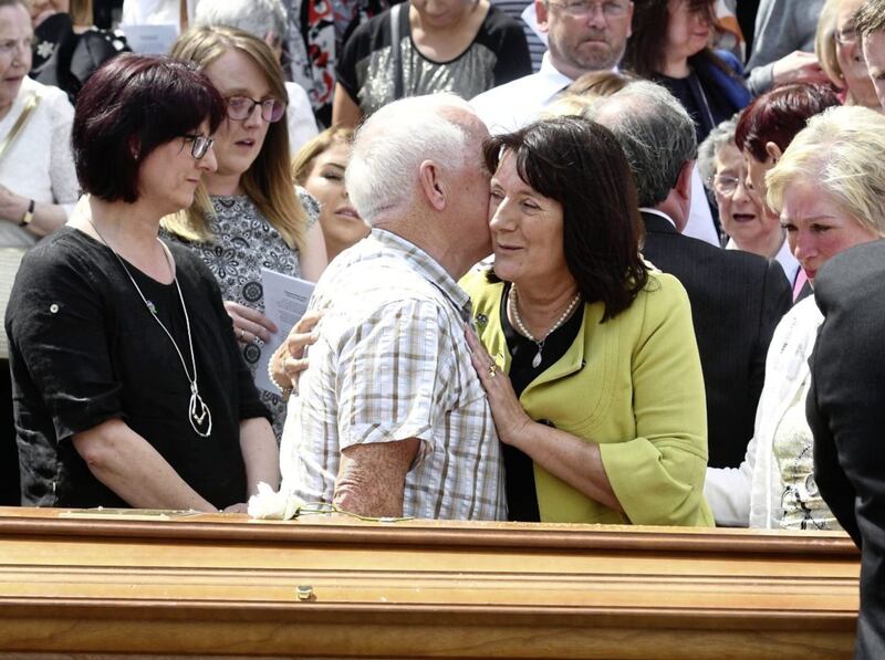 Anne Morgan is comforted at the funeral of her brother Seamus Ruddy in Newry on Saturday. Picture by Colm Lenaghan/Pacemaker 