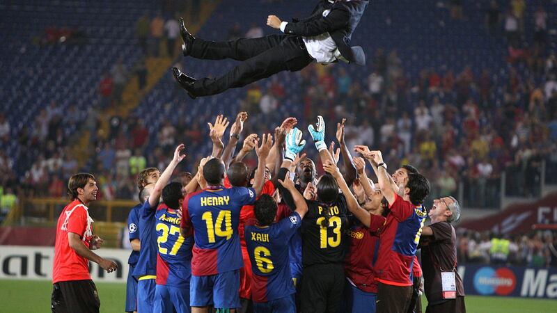 Barcelona coach Pep Guardiola is flung into the air by his team after the 2009 UEFA Champions League final at the Olympic Stadium, Rome