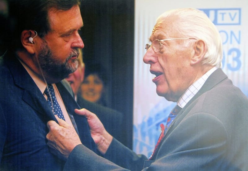 Rev Ian Paisley grabs journalist Ivan Little during a TV interview at the North Antrim count at Ballymoney in the Northern Ireland election in 2003 