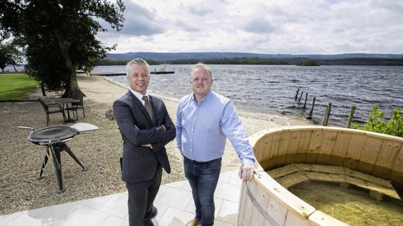 Darren Ward, relationship manager at First Trust Bank, with Darren Johnston, owner and manager of the Rossharbour Resort outside one of the property&#39;s glamping pods on the shores of Lower Lough Erne 