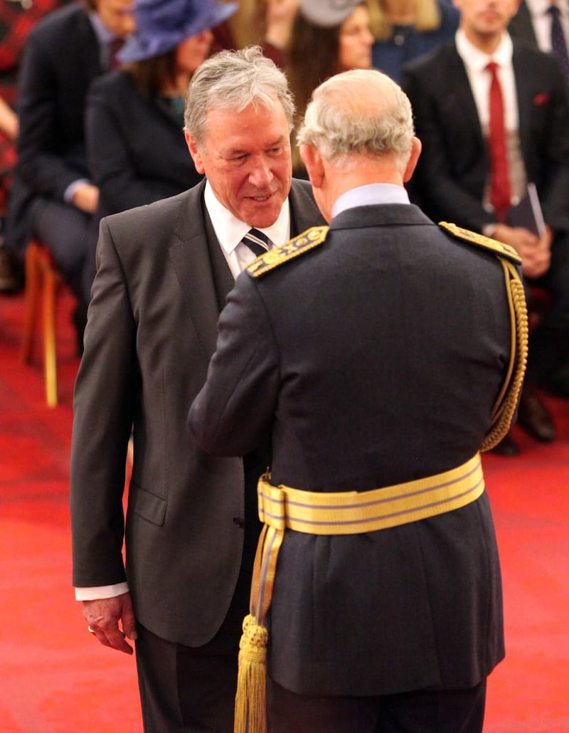 Timother Bentinck is made an MBE by the Prince of Wales at Buckingham Palace