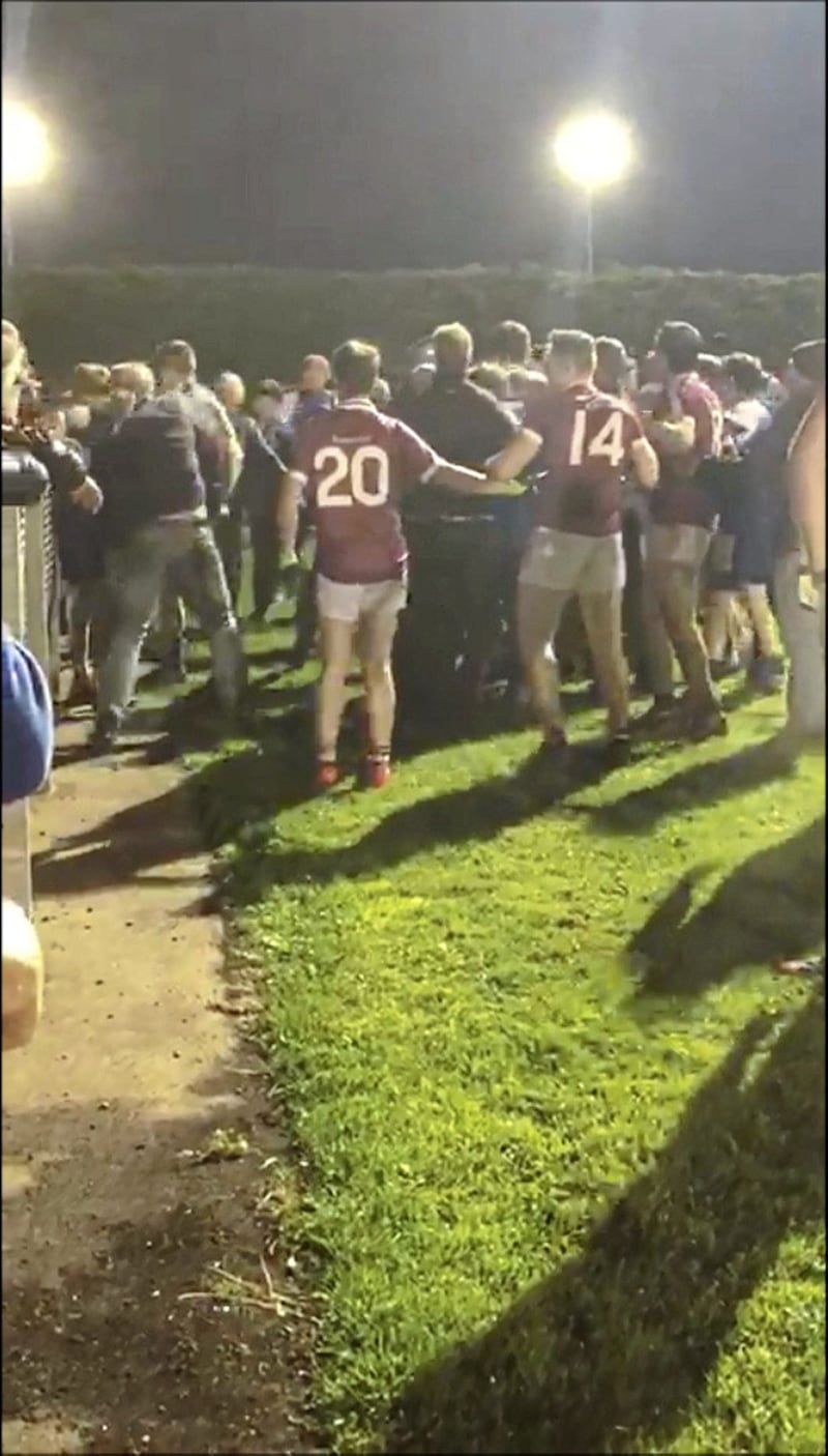 An on-pitch fight at a match between Slaughtneil and Ballinderry on Thursday spilled into the crowd 