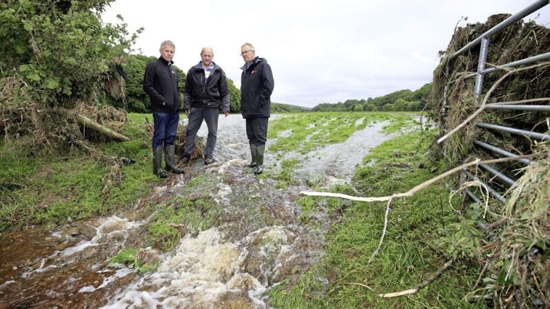 DAERA has announced that it intends to assist farmers in the Glenelly and Owenkillew valleys with the disposal of dead animals following the flooding. Tyrone farmer Drew Fleming shows UFU leaders Barclay Bell and Ivor Ferguson some of the storm damage on his land. Picture by Cliff Donaldson 