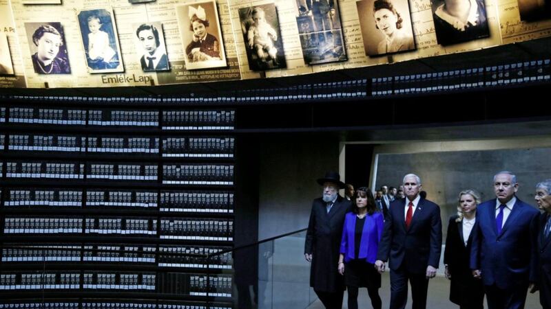US vice president Mike Pence (centre), wife Karen (second left), chairman of the Yad Vashem Council Rabbi Israel Meir Lau (left), Israeli prime minister Benjamin Netanyahu (right) and wife Sara Netanyahu (second right) visit the Hall of Names in Yad Vashem Holocaust History Museum in Jerusalem on Tuesday. Picture by Ronen Zvulun, Pool photo via Associated Press 
